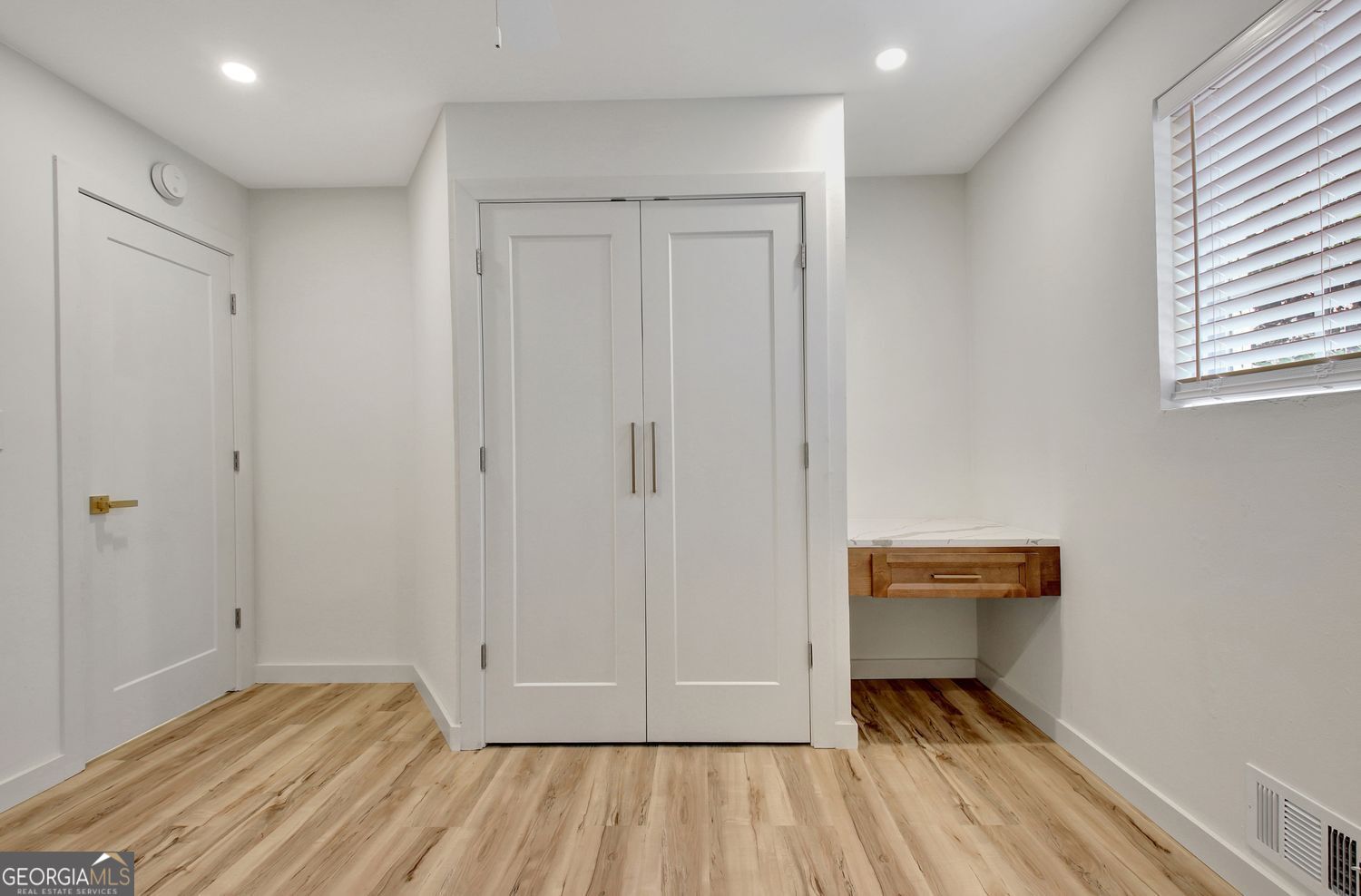 183 Pine Street Northeast Fairburn, GA 30213 - Photo 58 of 68 a view of room with window and wooden floor