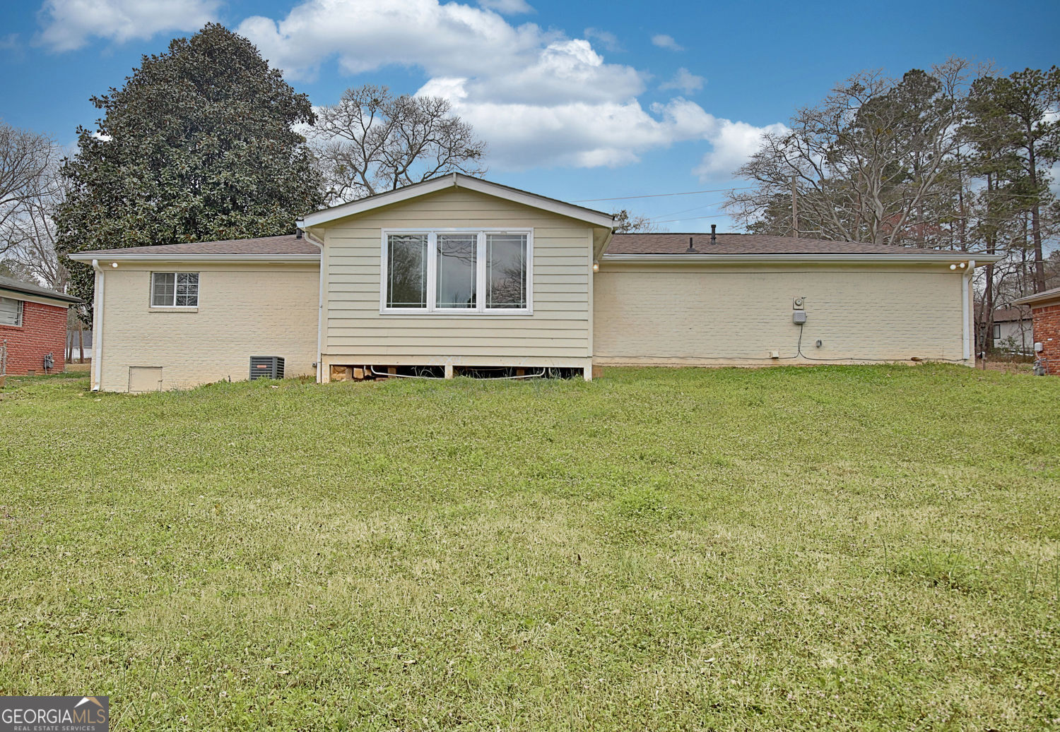 183 Pine Street Northeast Fairburn, GA 30213 - Photo 63 of 68 a house with trees in the background