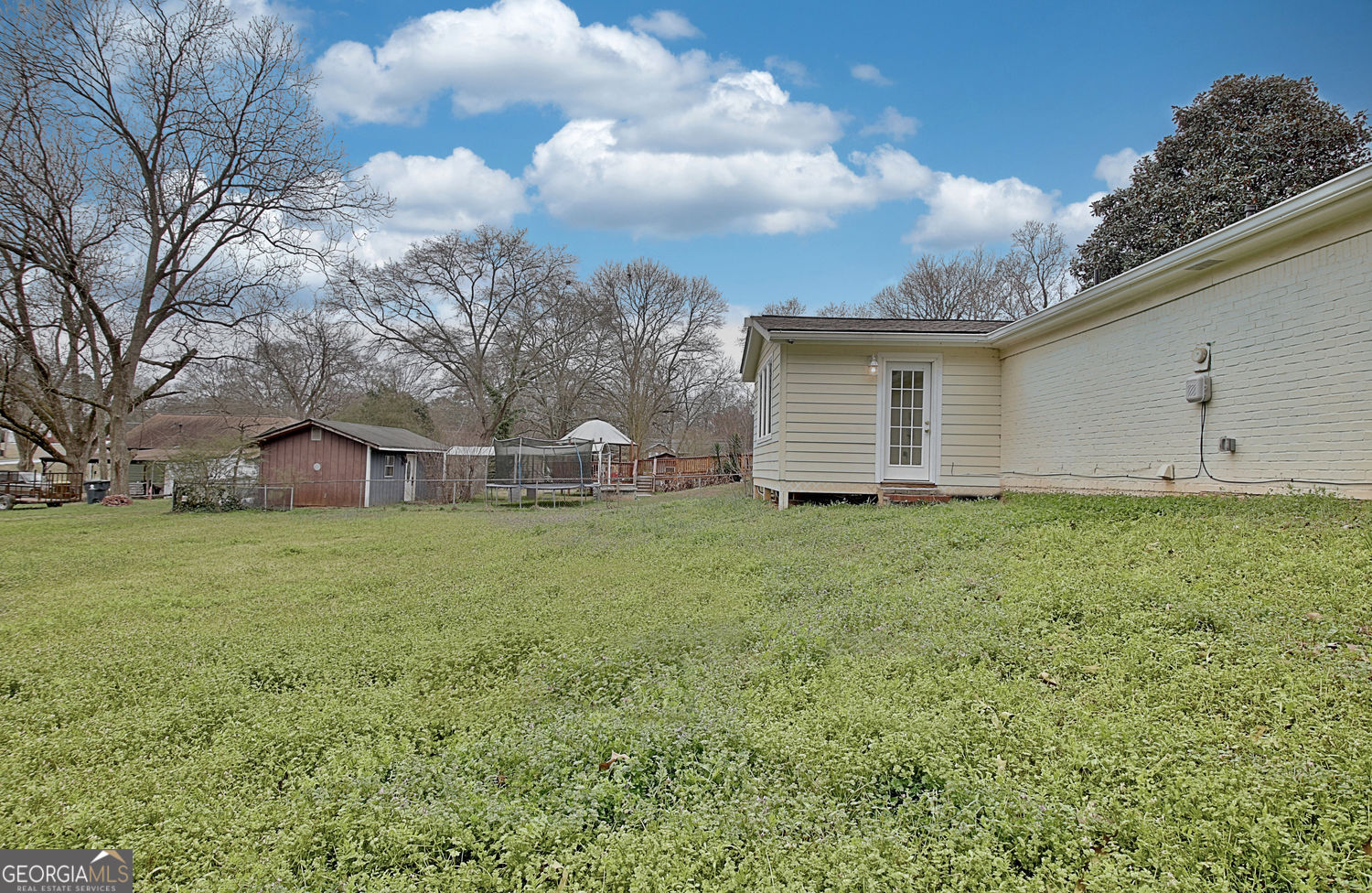 183 Pine Street Northeast Fairburn, GA 30213 - Photo 64 of 68 a backyard of a house with lots of green space