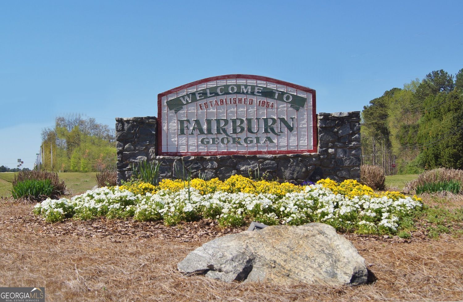 183 Pine Street Northeast Fairburn, GA 30213 - Photo 67 of 68 a sign on the side of the road