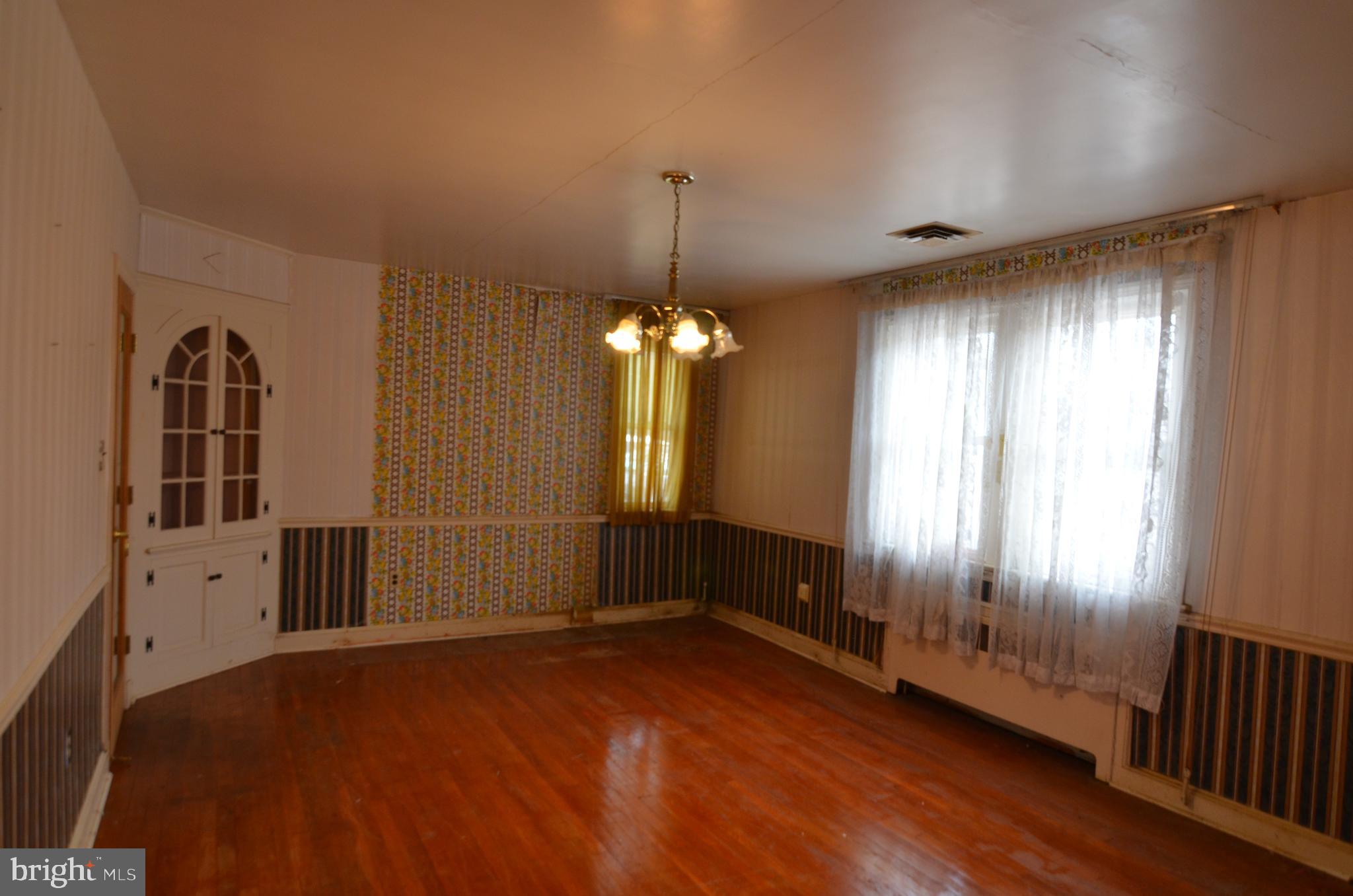 206 Shaw Avenue Silver Spring, MD 20904 - Photo 14 of 35 wooden floor in an empty room with a window