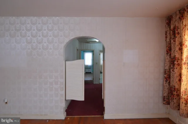 a bathroom with a toilet a sink and a window