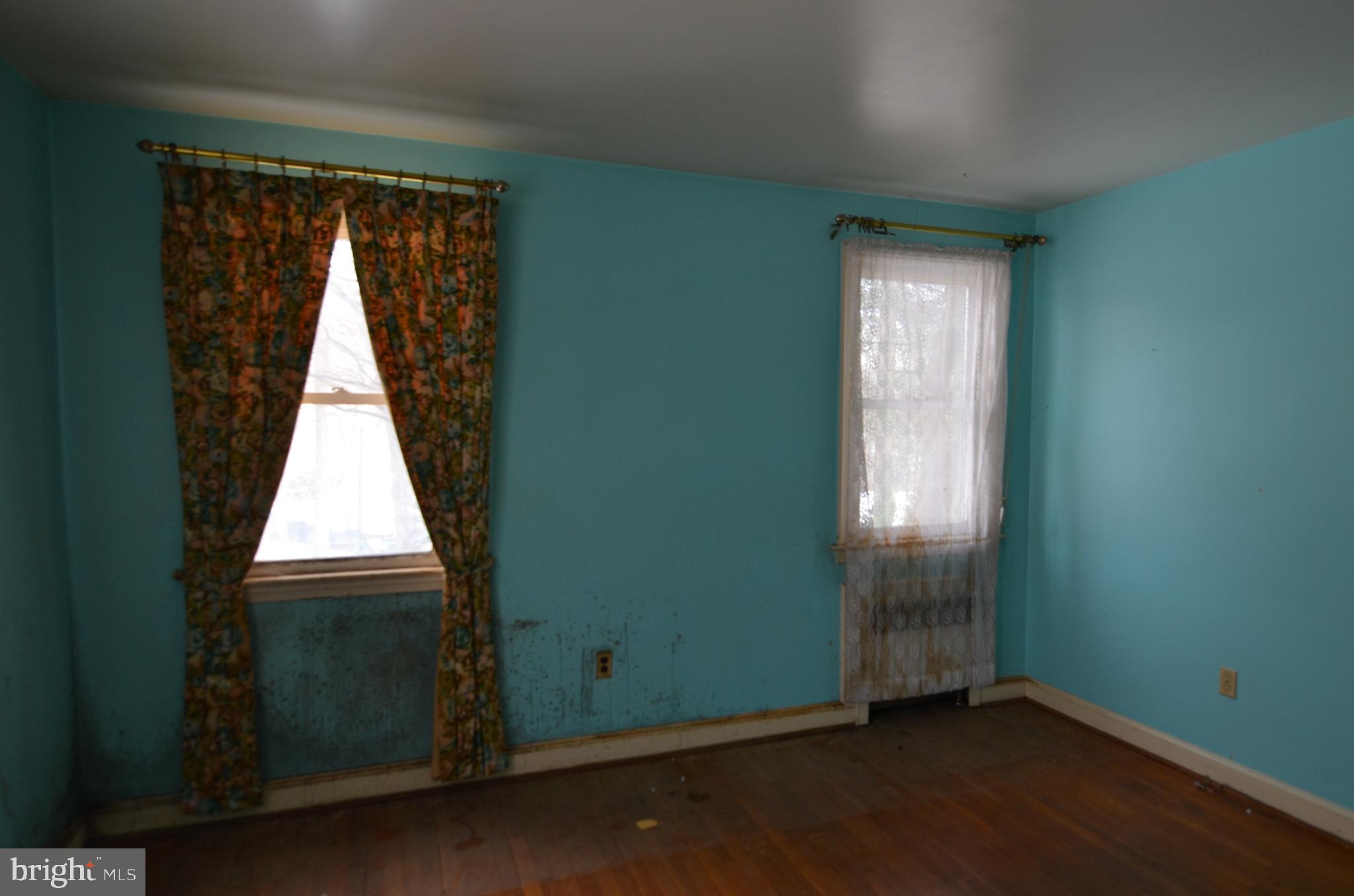 206 Shaw Avenue Silver Spring, MD 20904 - Photo 25 of 35 an view of an empty room with wooden floor and a window