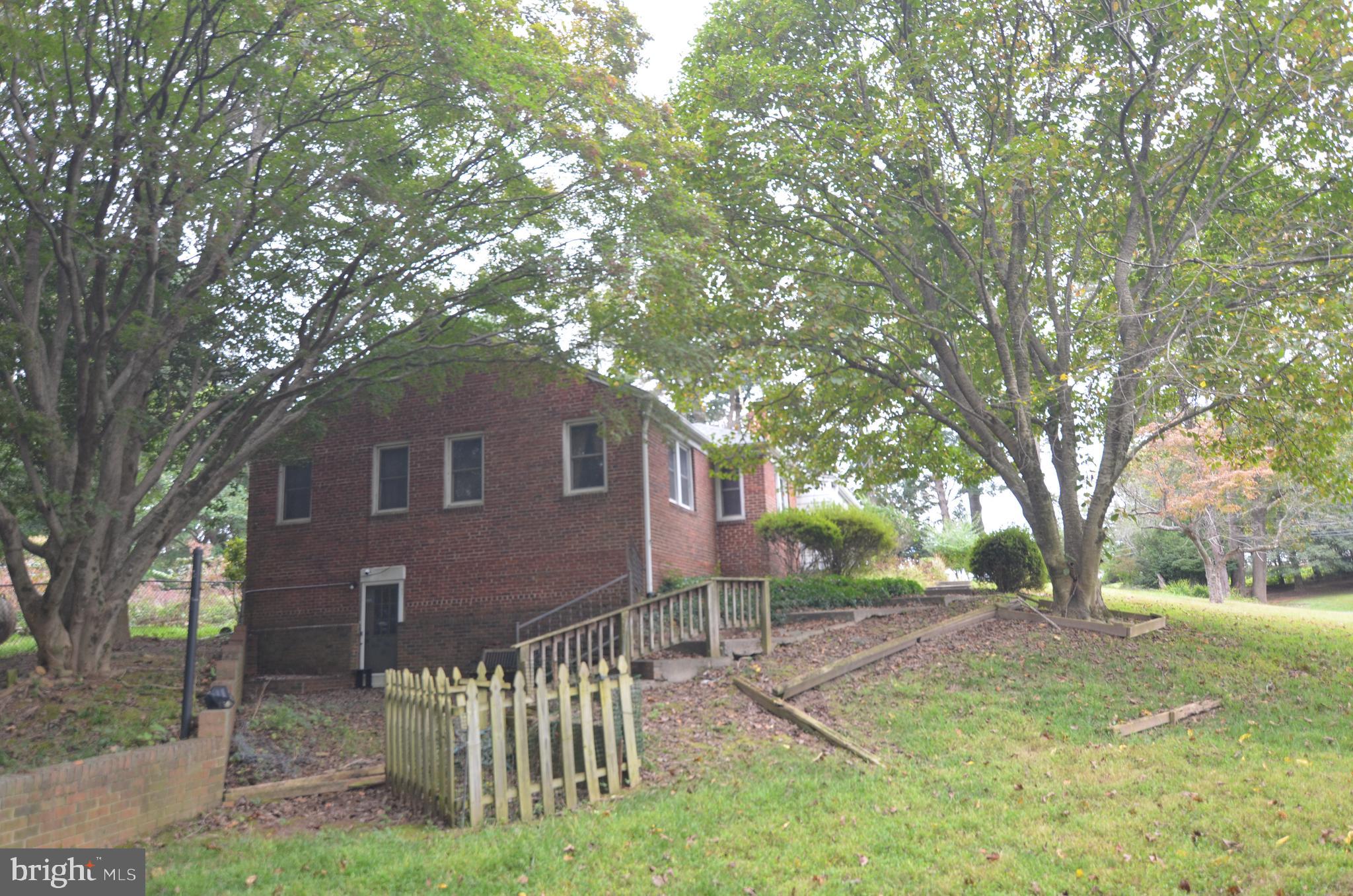 206 Shaw Avenue Silver Spring, MD 20904 - Photo 4 of 35 a front view of a house with a yard