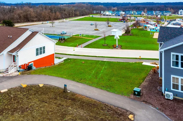 an aerial view of a house with a garden and yard