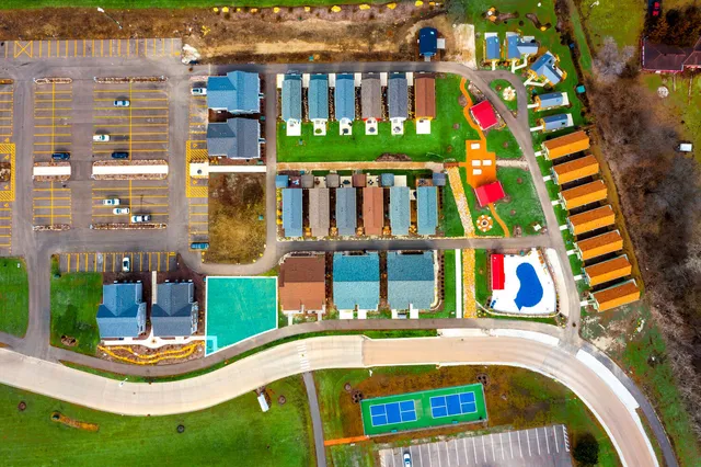 a view of swimming pool with outdoor seating and yard in back
