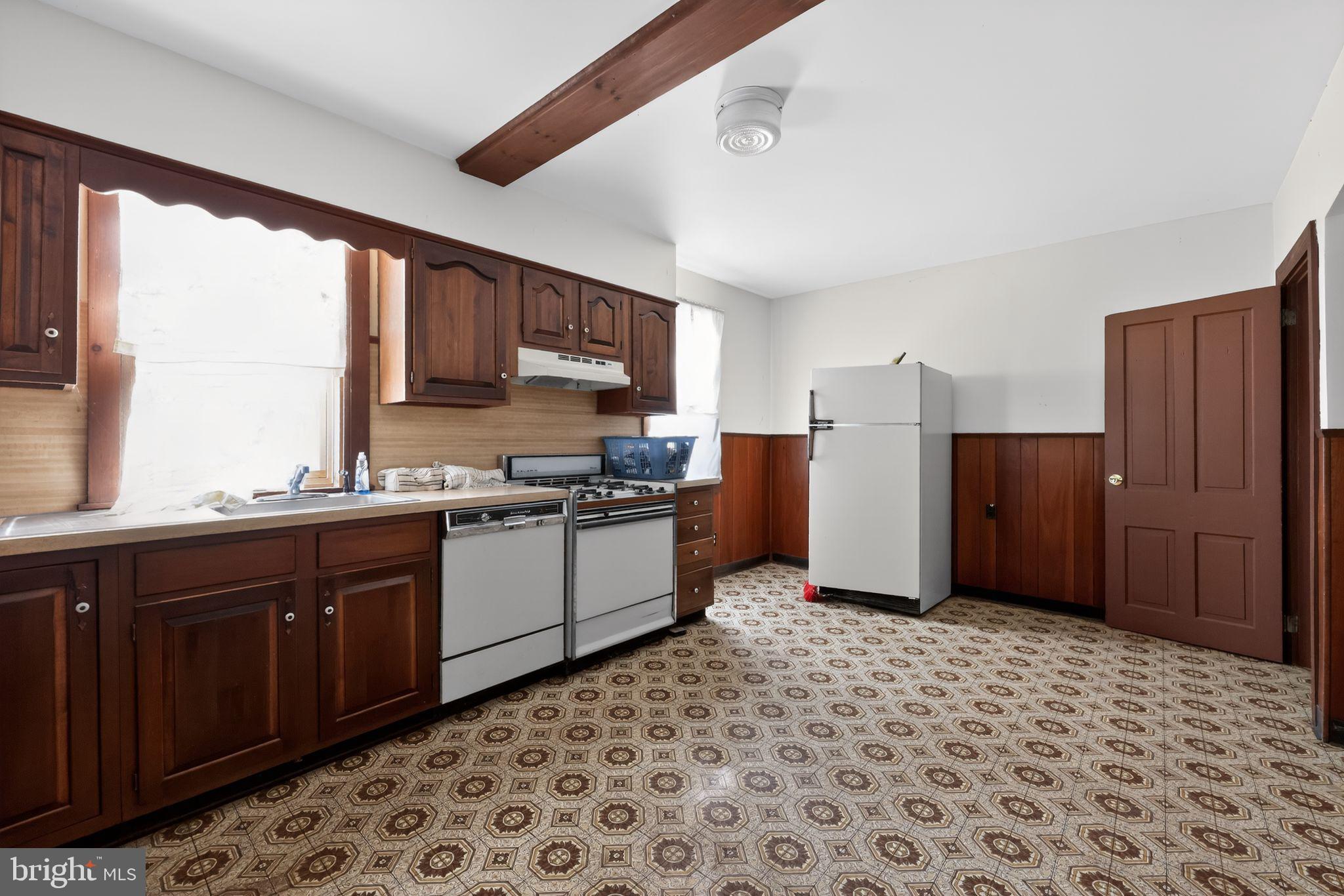 113 South Chestnut Street Ambler, PA 19002 - Photo 13 of 30 a kitchen with a refrigerator and a sink