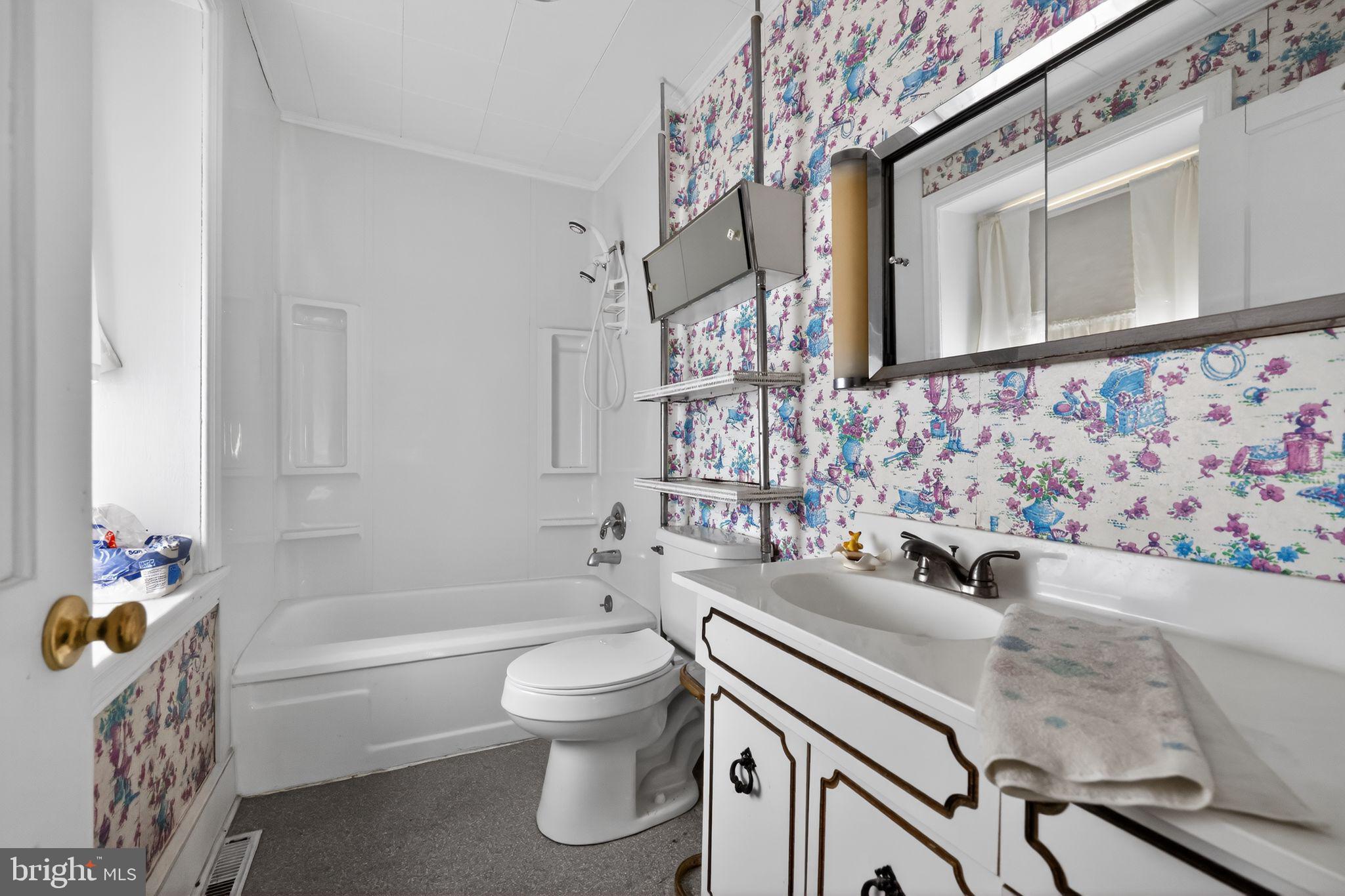 113 South Chestnut Street Ambler, PA 19002 - Photo 22 of 30 a bathroom with a sink a toilet and bathtub