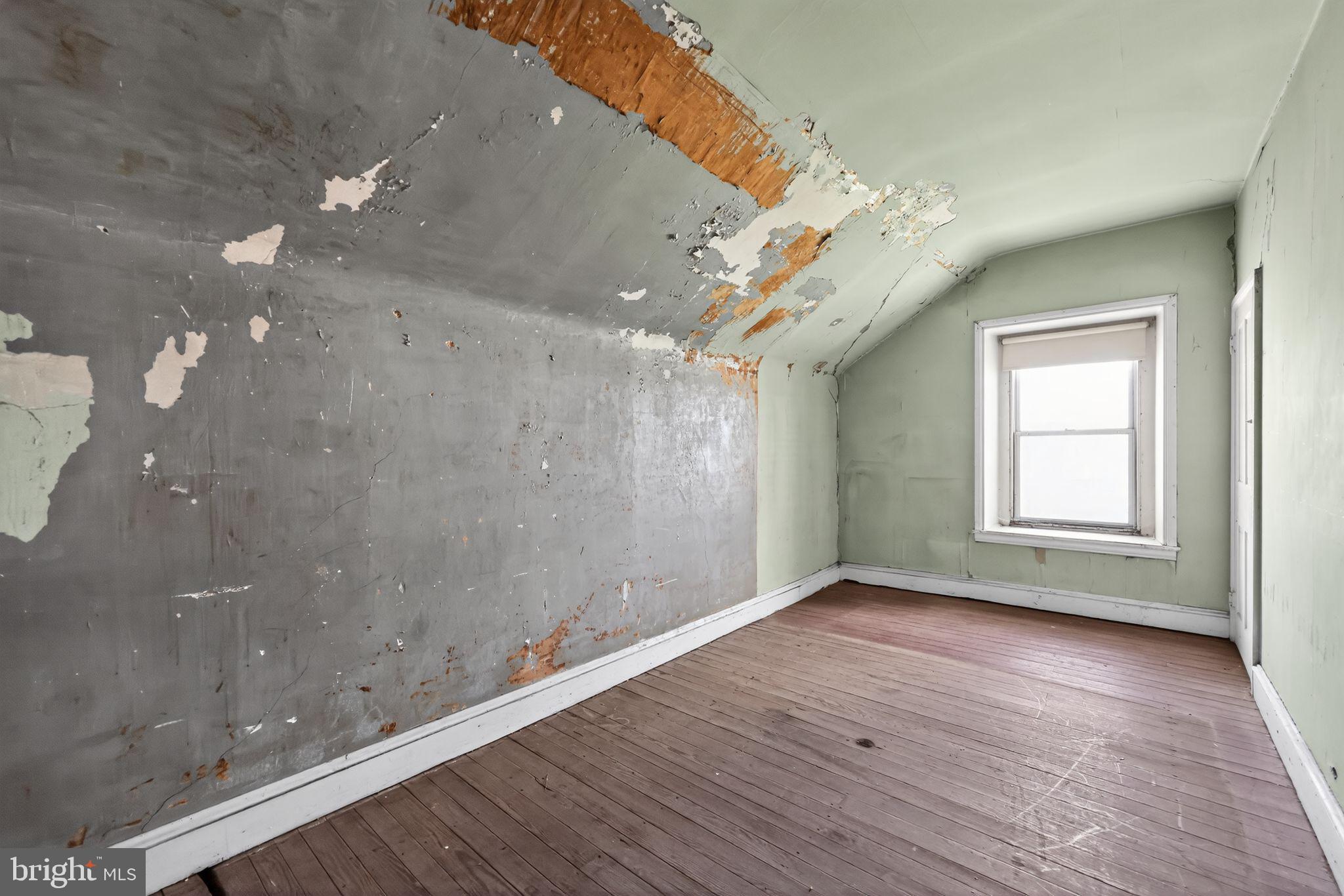 113 South Chestnut Street Ambler, PA 19002 - Photo 29 of 30 an empty room with wooden floor and windows