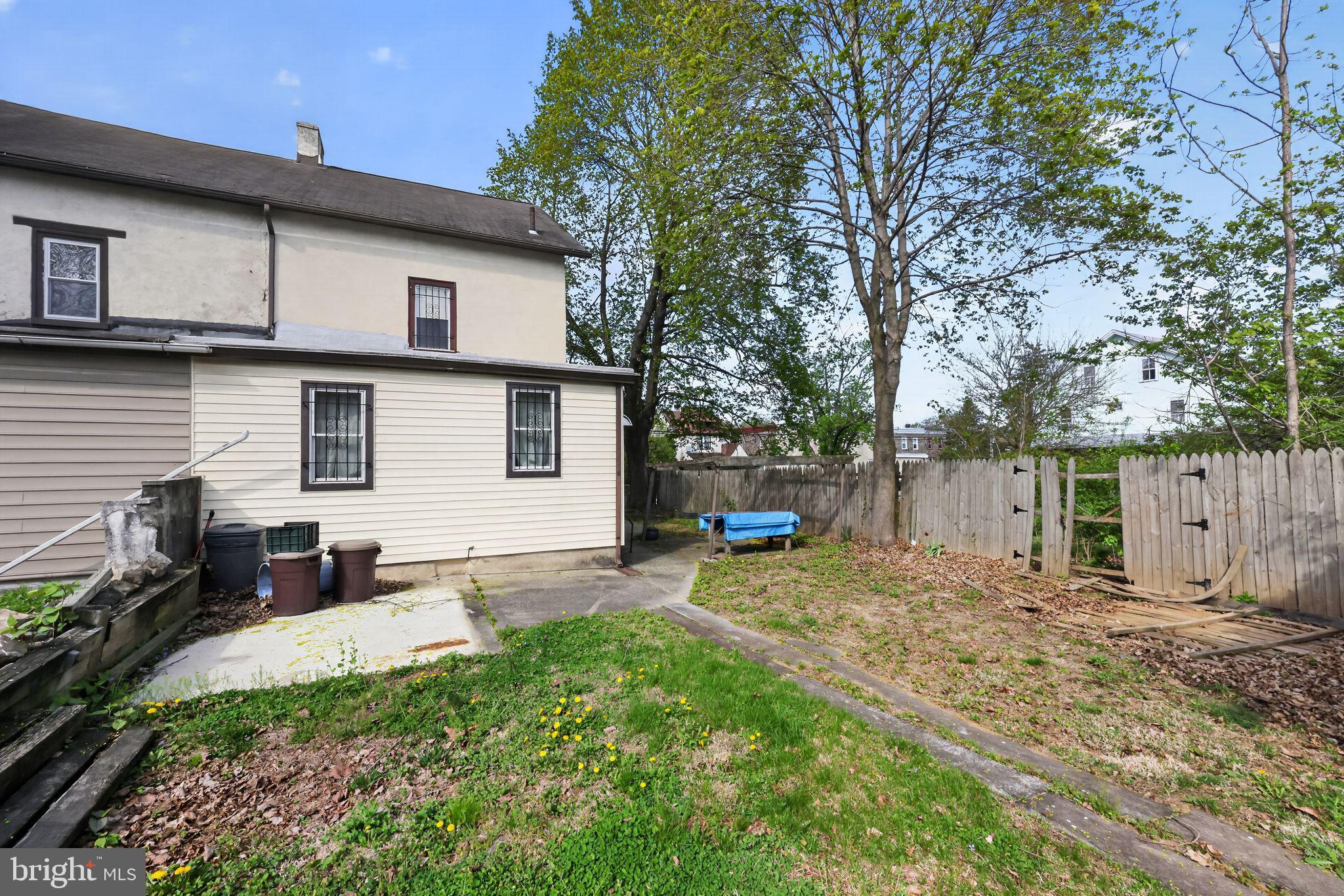 113 South Chestnut Street Ambler, PA 19002 - Photo 3 of 30 a backyard of a house with table and chairs
