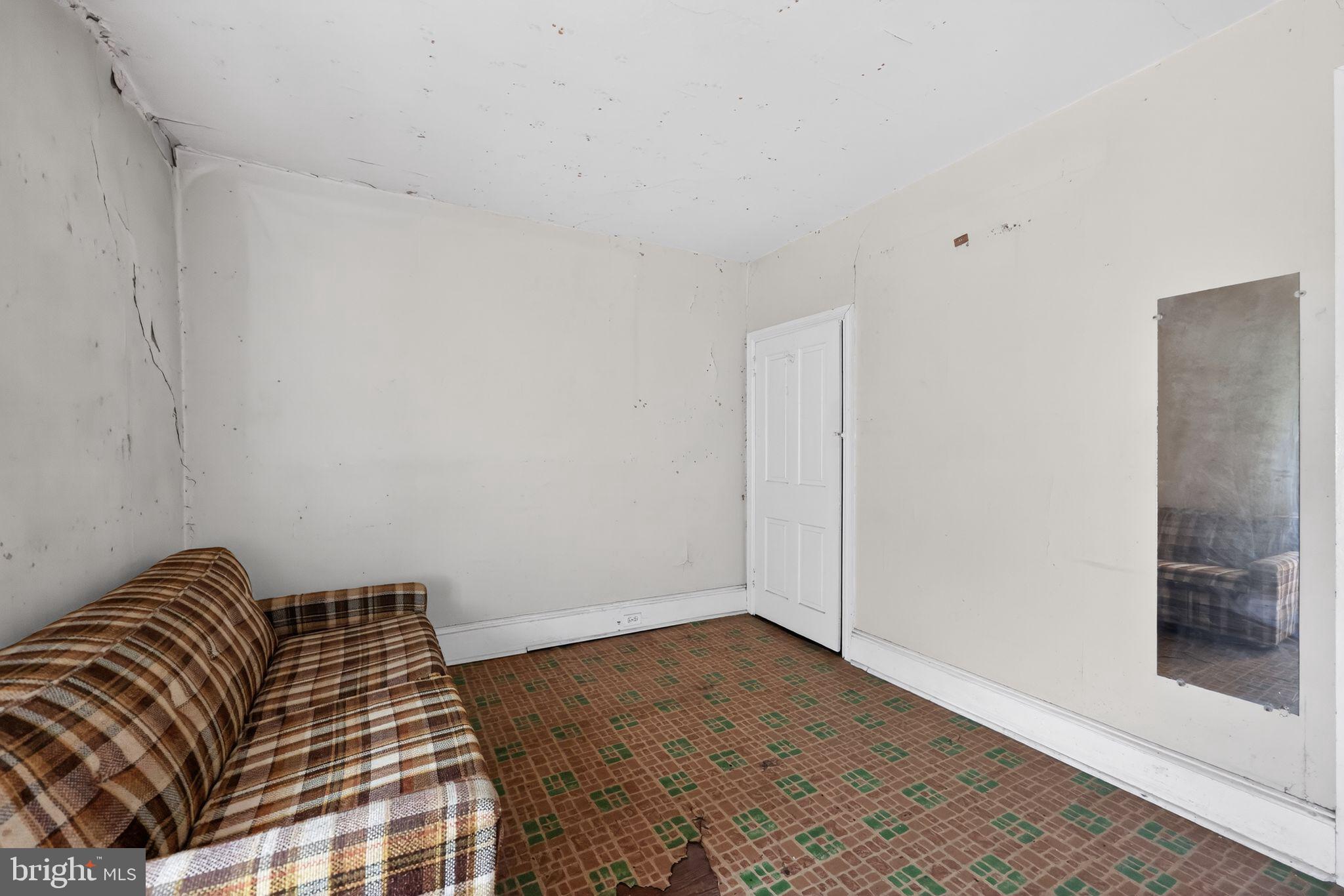113 South Chestnut Street Ambler, PA 19002 - Photo 7 of 30 a bedroom with a bed and wooden floor