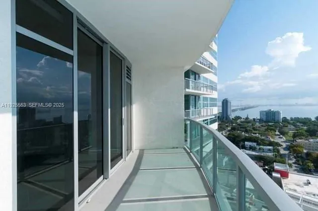 a balcony with view of city