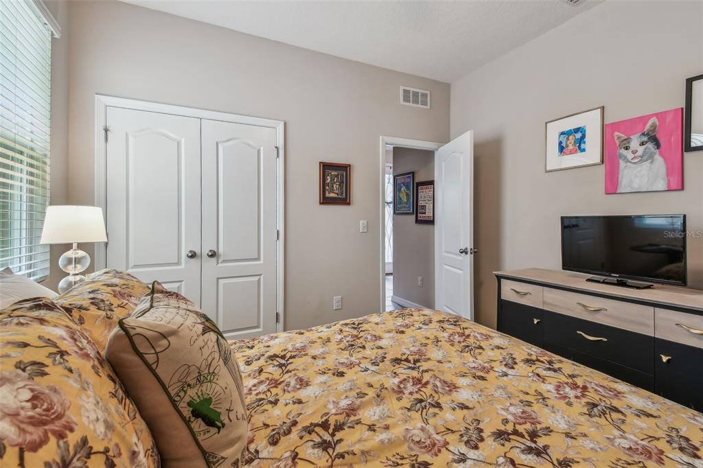6467 Seasound Drive Apollo Beach, FL 33572 - Photo 12 of 81 a bedroom with a bed and a flat screen tv