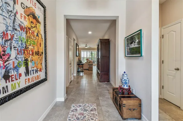 a kitchen with kitchen island granite countertop a sink a counter top space appliances and cabinets
