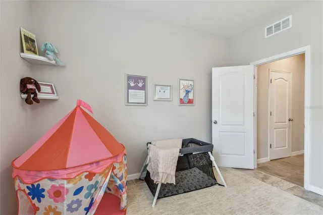 a kitchen with kitchen island granite countertop a sink a counter top space cabinets and stainless steel appliances