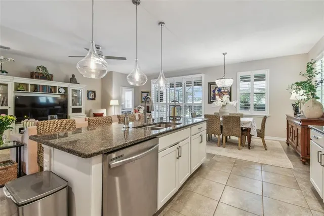a view of a living room kitchen and a wooden floor