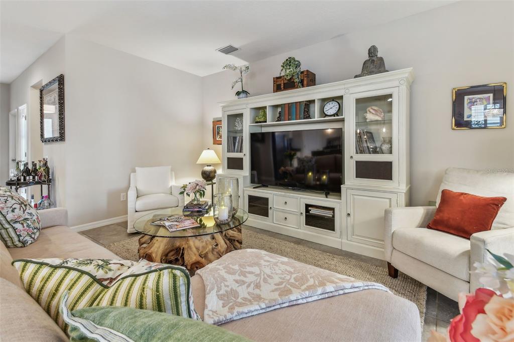 6467 Seasound Drive Apollo Beach, FL 33572 - Photo 36 of 81 a living room with furniture and a flat screen tv