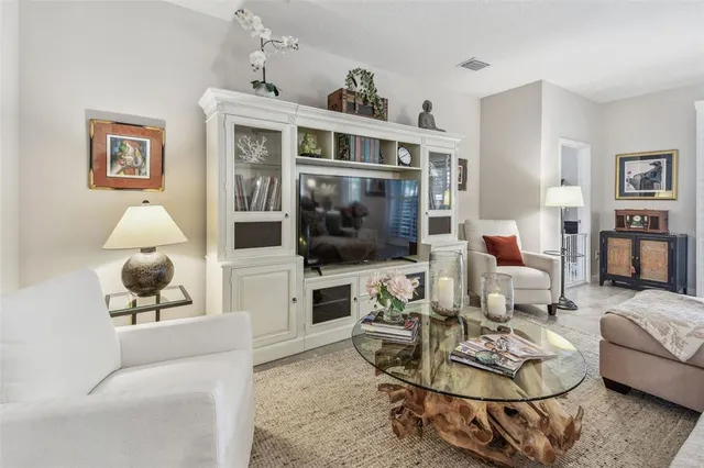 a living room with a large window and a table