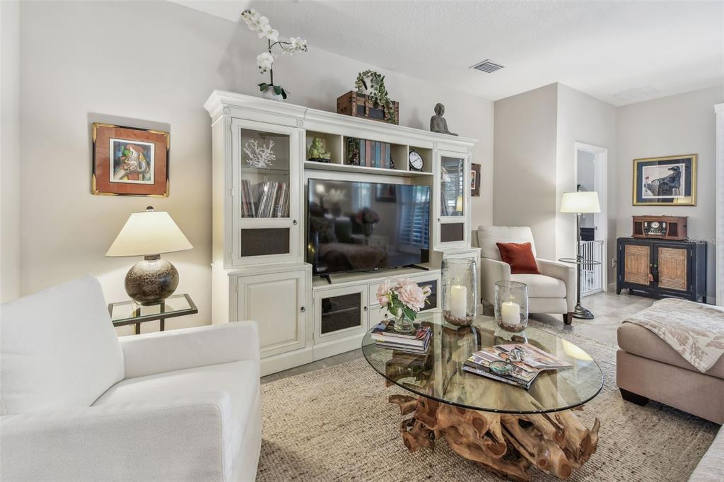 6467 Seasound Drive Apollo Beach, FL 33572 - Photo 37 of 81 a living room with furniture and a flat screen tv