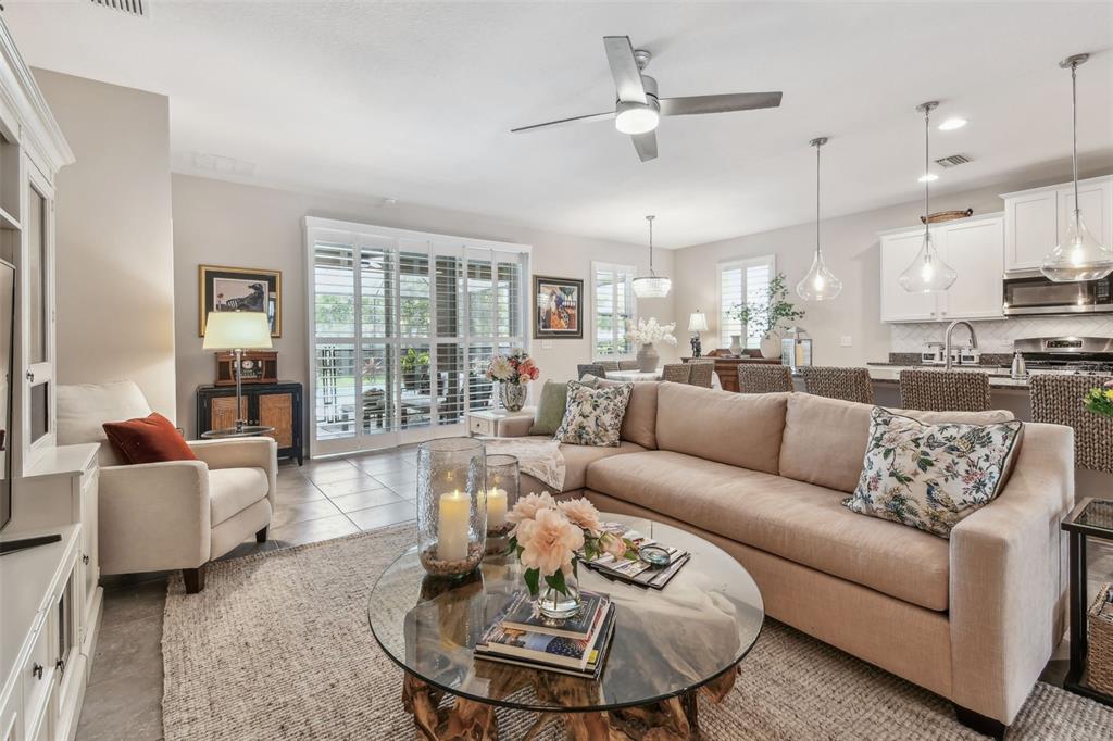 6467 Seasound Drive Apollo Beach, FL 33572 - Photo 38 of 81 a living room with furniture kitchen and a large window
