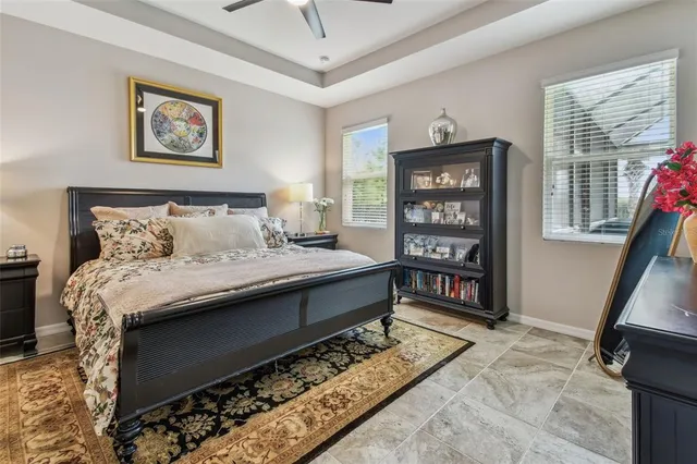 a view of a swimming pool with a patio and a yard