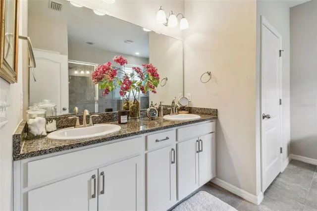 an aerial view of a city with lots of residential buildings lake and ocean view