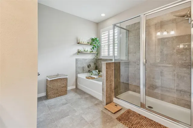 an aerial view of residential houses with outdoor space and street view