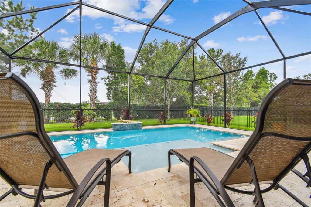 6467 Seasound Drive Apollo Beach, FL 33572 - Photo 51 of 81 a view of yard with a table and chair under an umbrella