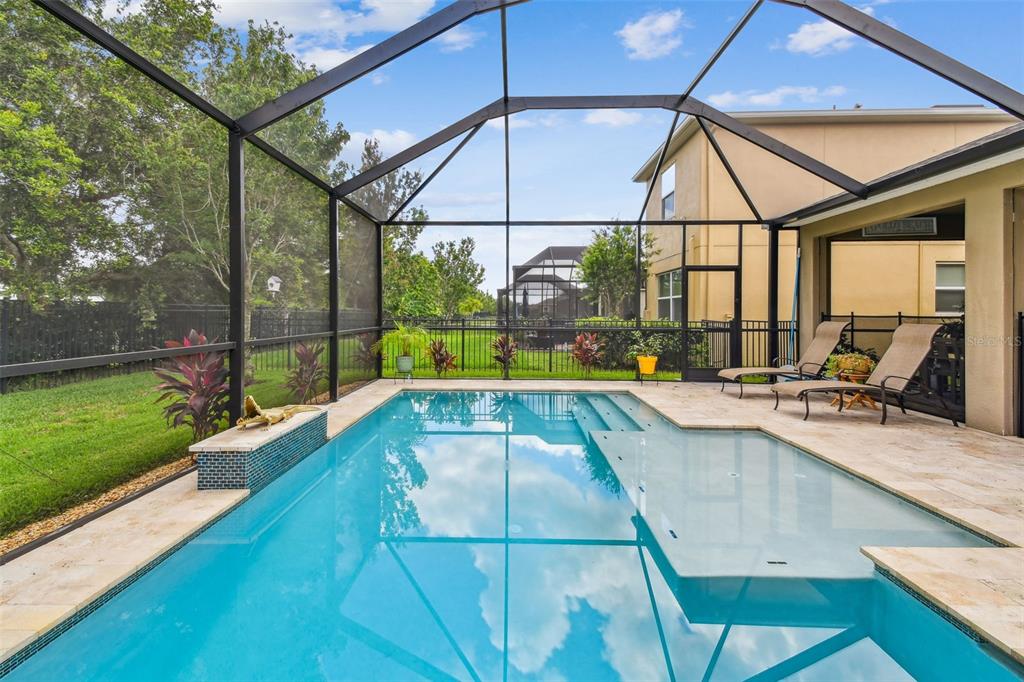 6467 Seasound Drive Apollo Beach, FL 33572 - Photo 53 of 81 a view of a swimming pool with a patio and a yard