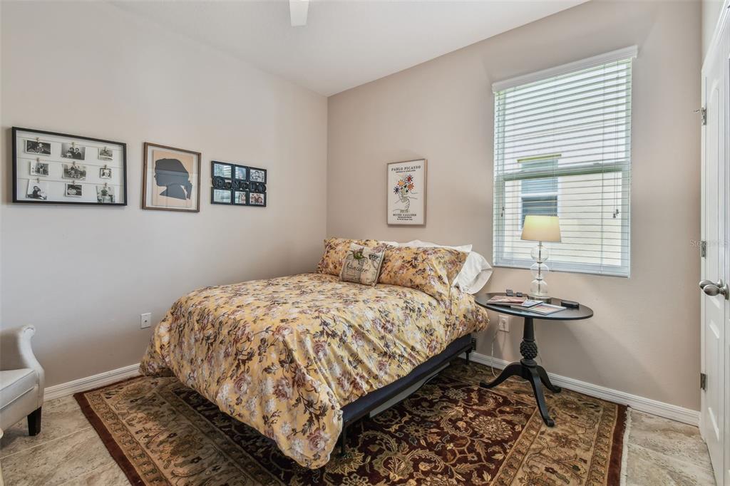 6467 Seasound Drive Apollo Beach, FL 33572 - Photo 10 of 81 a bedroom with a bed and a window