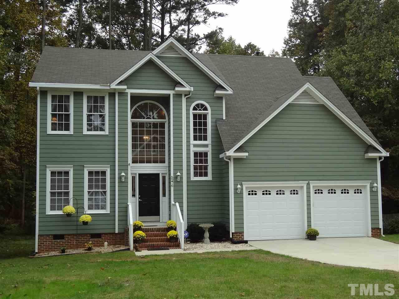 5276 Fairmead Circle Raleigh, NC 27613 - Photo 1 of 25 a view of a house with a big yard and large trees