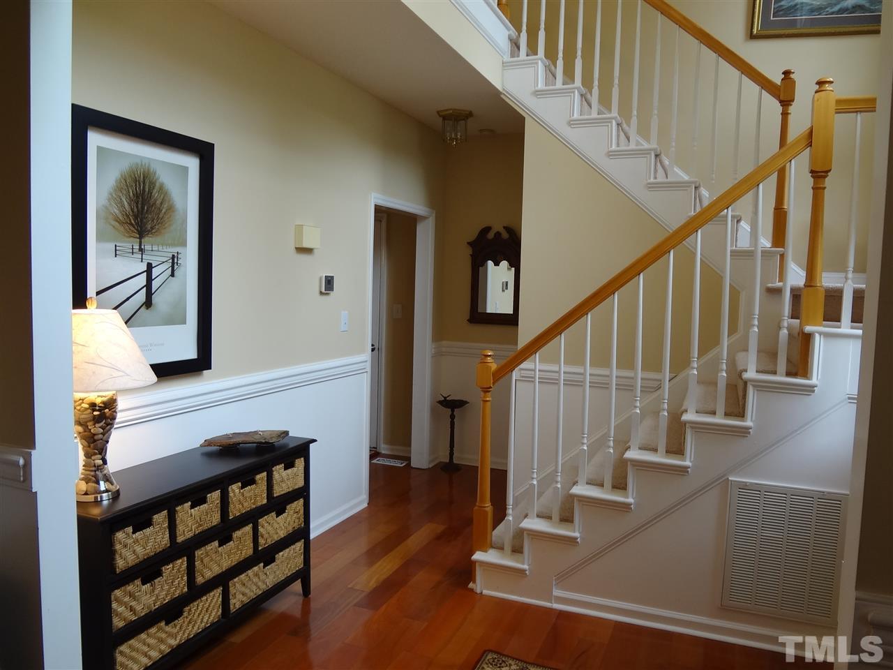 5276 Fairmead Circle Raleigh, NC 27613 - Photo 2 of 25 a view of entryway and hall with wooden floor