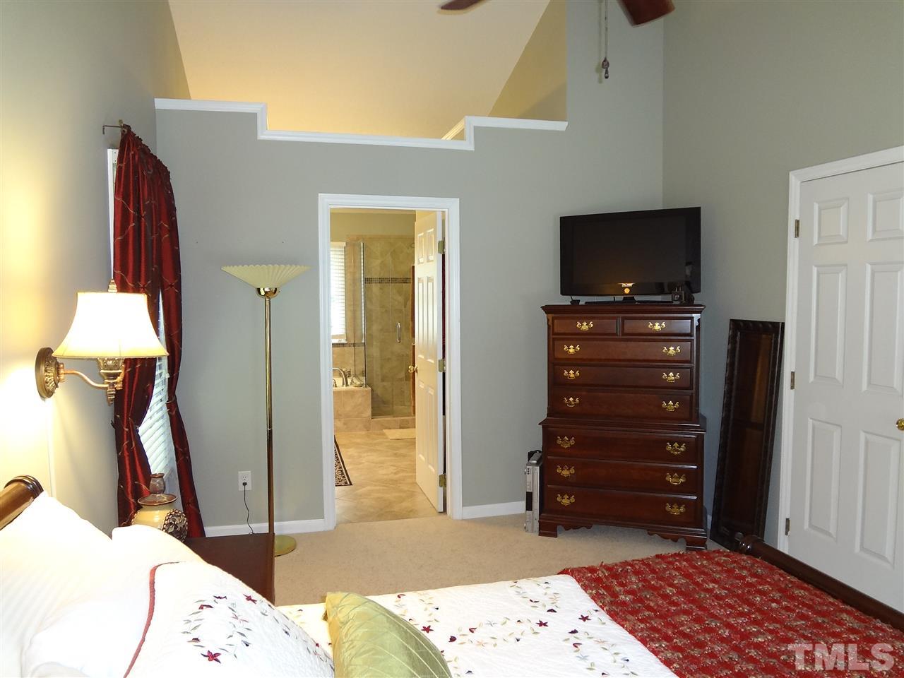 5276 Fairmead Circle Raleigh, NC 27613 - Photo 12 of 25 a bedroom with a bed and furniture