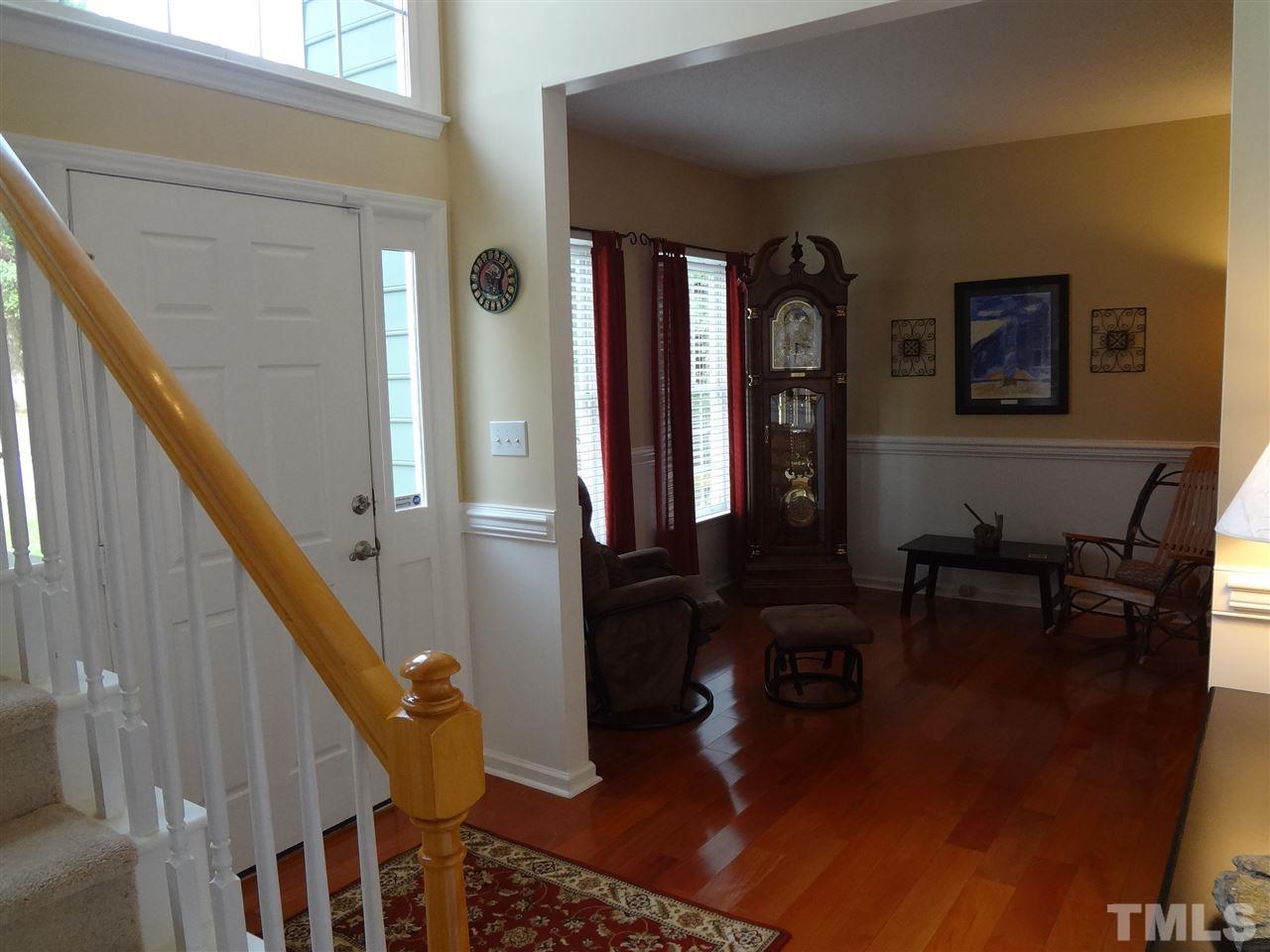 5276 Fairmead Circle Raleigh, NC 27613 - Photo 3 of 25 a view of hall way with furniture and stairs
