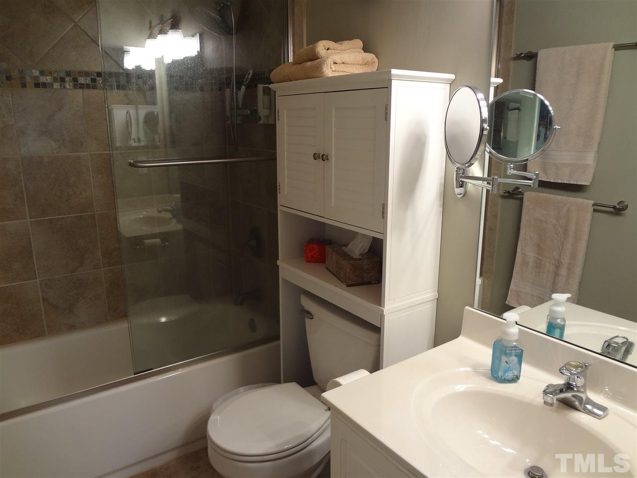 5276 Fairmead Circle Raleigh, NC 27613 - Photo 21 of 25 a bathroom with a sink toilet and shower