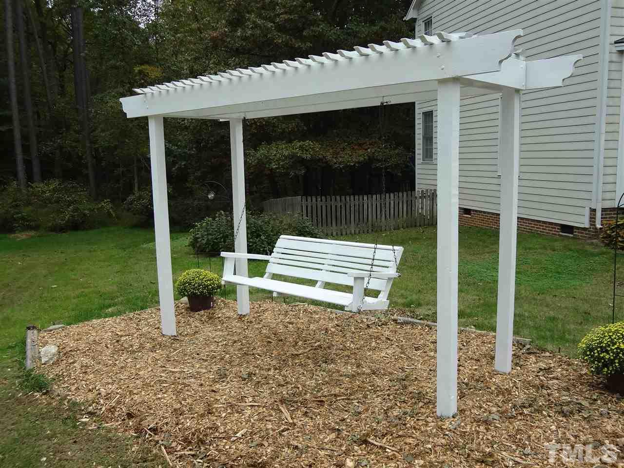 5276 Fairmead Circle Raleigh, NC 27613 - Photo 25 of 25 a view of a backyard with a garden and entertaining space