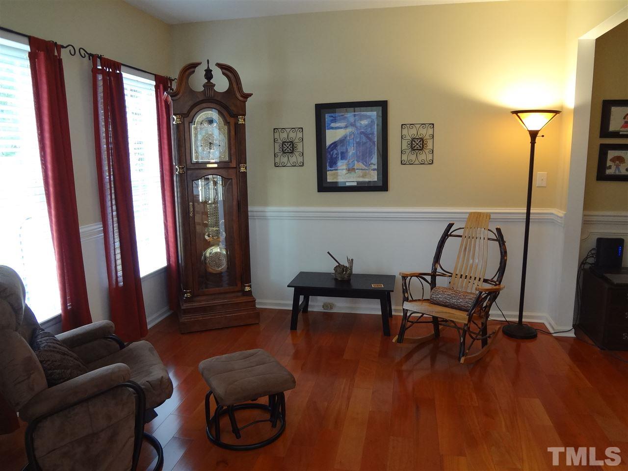 5276 Fairmead Circle Raleigh, NC 27613 - Photo 4 of 25 a living room with furniture and a wooden floor