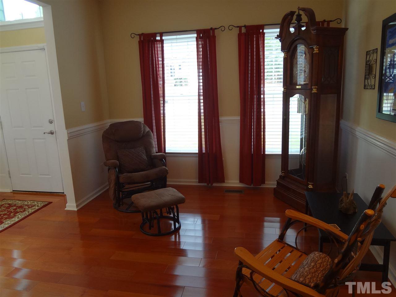 5276 Fairmead Circle Raleigh, NC 27613 - Photo 5 of 25 a living room with furniture and a window