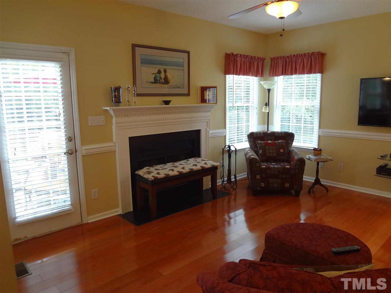 5276 Fairmead Circle Raleigh, NC 27613 - Photo 6 of 25 a living room with furniture fireplace and window