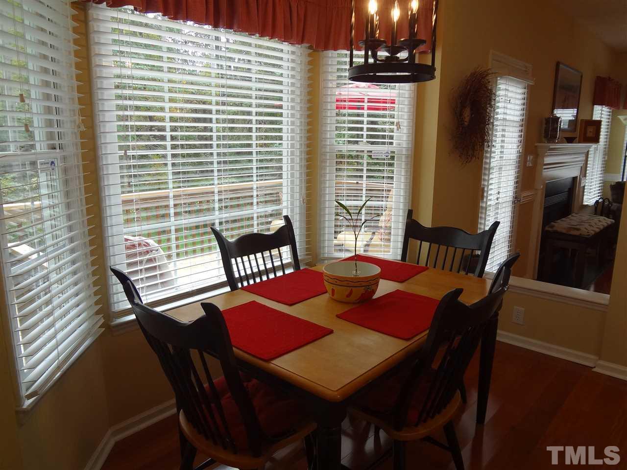 5276 Fairmead Circle Raleigh, NC 27613 - Photo 9 of 25 a view of a dining room with furniture and window