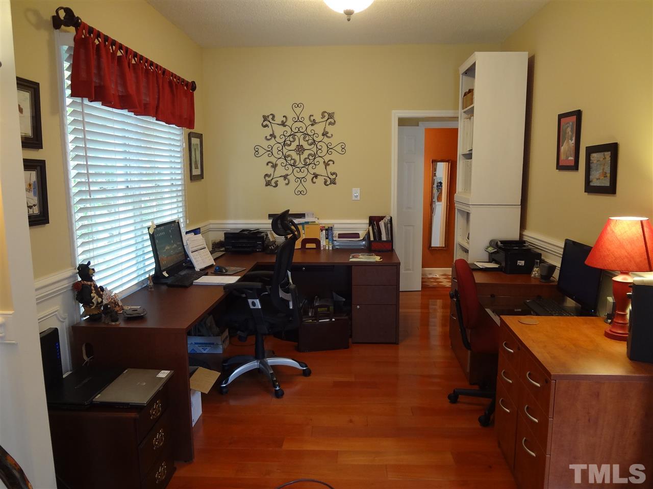 5276 Fairmead Circle Raleigh, NC 27613 - Photo 10 of 25 a view of a workspace with furniture and a window