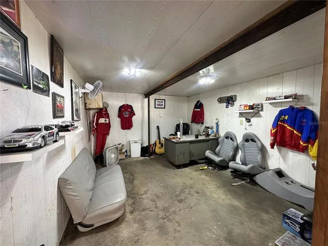 a bed room with furniture and a window