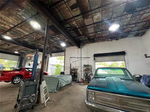 a bathroom with a toilet sink and a shower