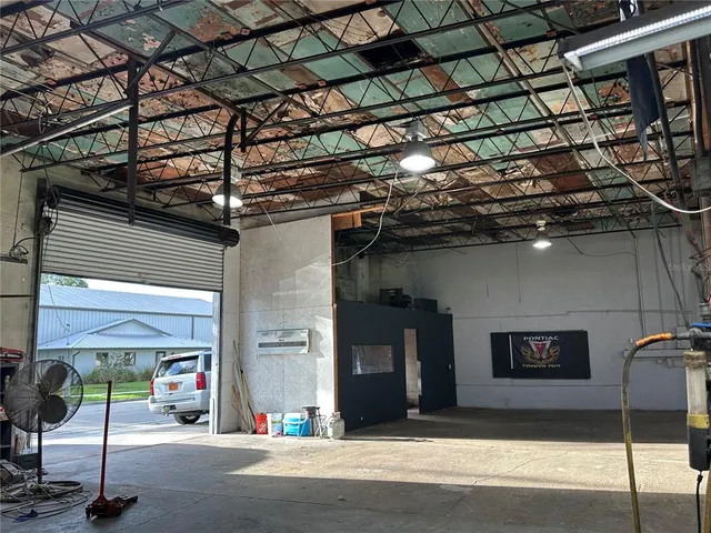 a room with lots of furniture and a chandelier