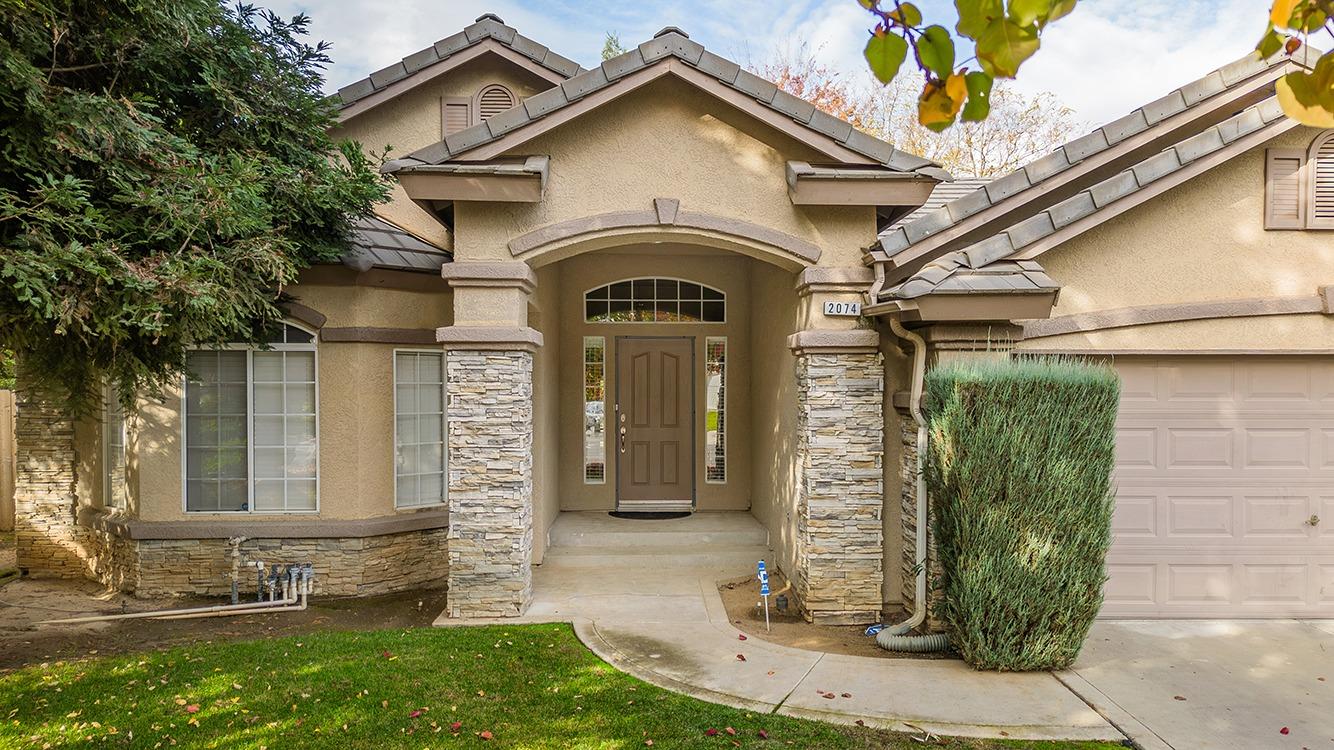 a view of a house with a small garden