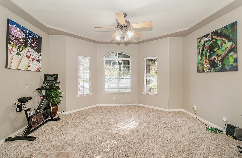 2074 East Revere Road Fresno, CA 93720 - Photo 11 of 39 a view of livingroom with window and workspace