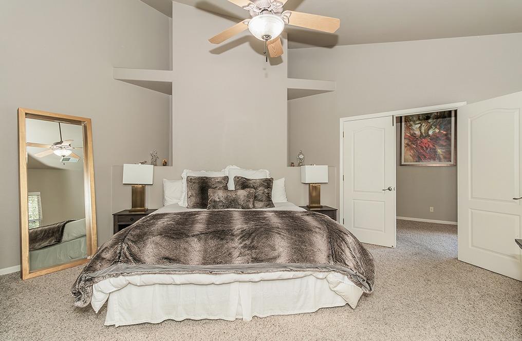 2074 East Revere Road Fresno, CA 93720 - Photo 15 of 39 a large white bed in a white room