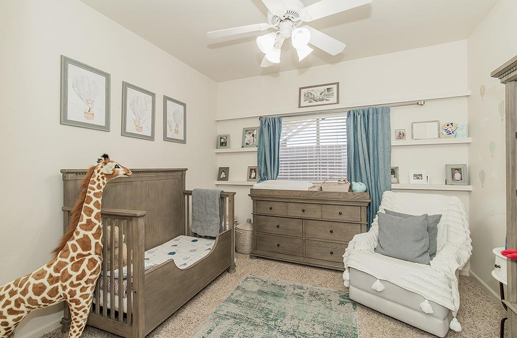2074 East Revere Road Fresno, CA 93720 - Photo 19 of 39 a living room with furniture and a window