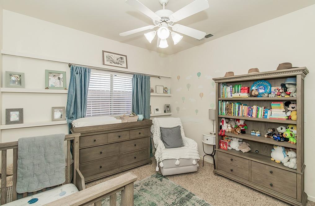 2074 East Revere Road Fresno, CA 93720 - Photo 20 of 39 a living room with furniture cabinets and window