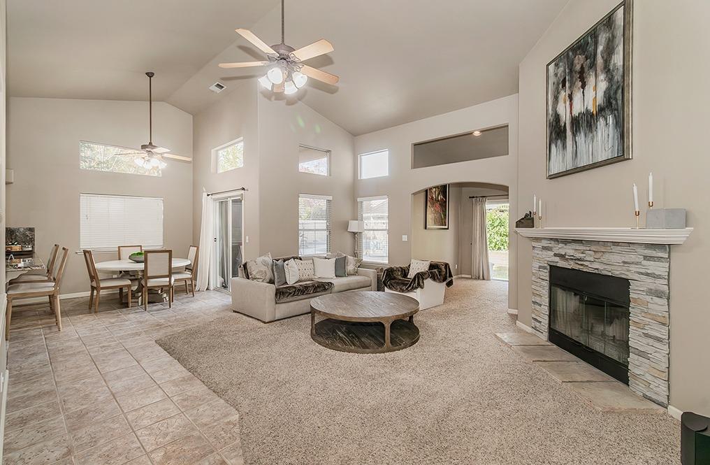 2074 East Revere Road Fresno, CA 93720 - Photo 3 of 39 a living room with furniture and a fireplace